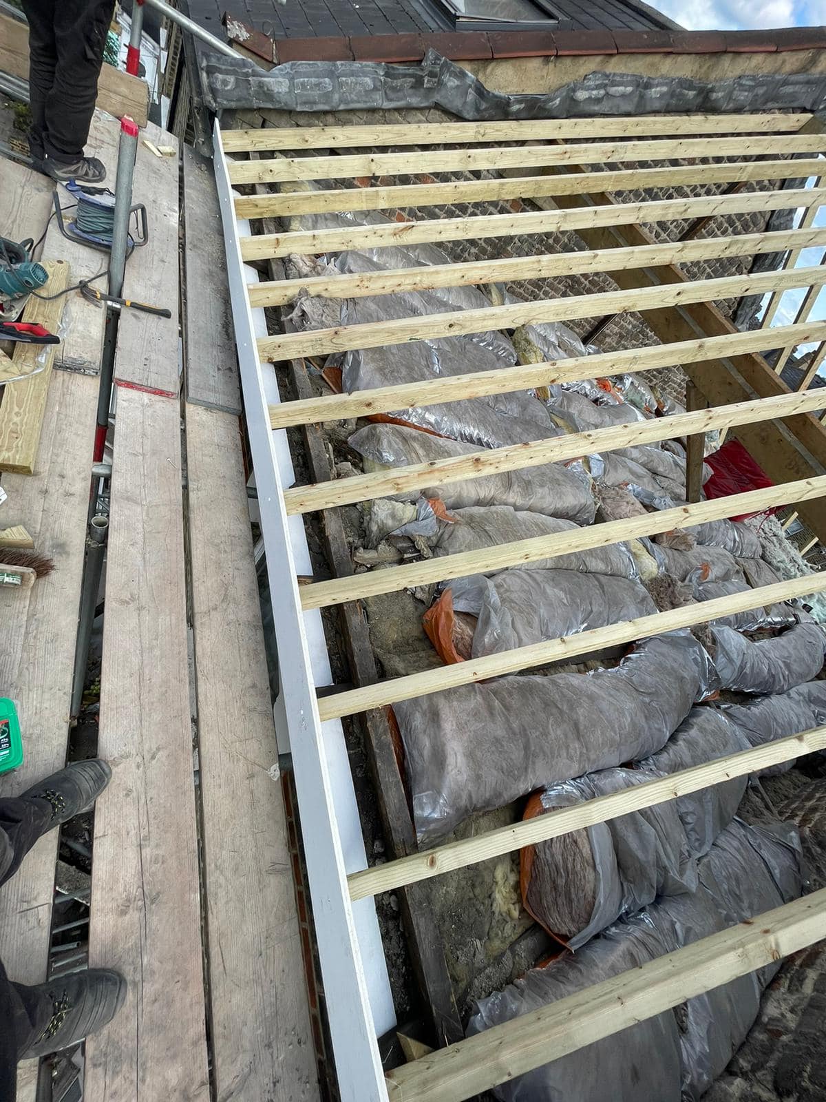 Professional roofers working on a property in London - KS Roof Master