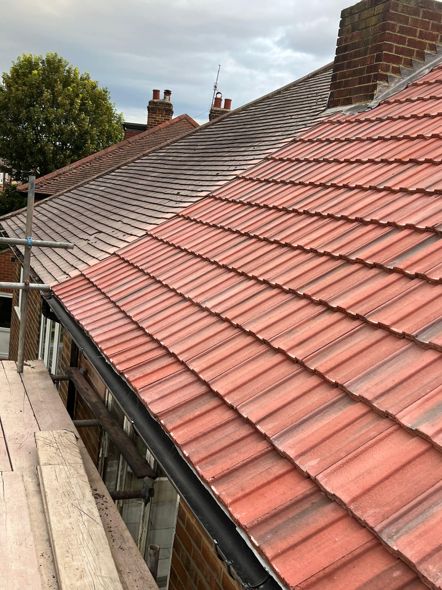 Professional roofers working on a property in London - KS Roof Master