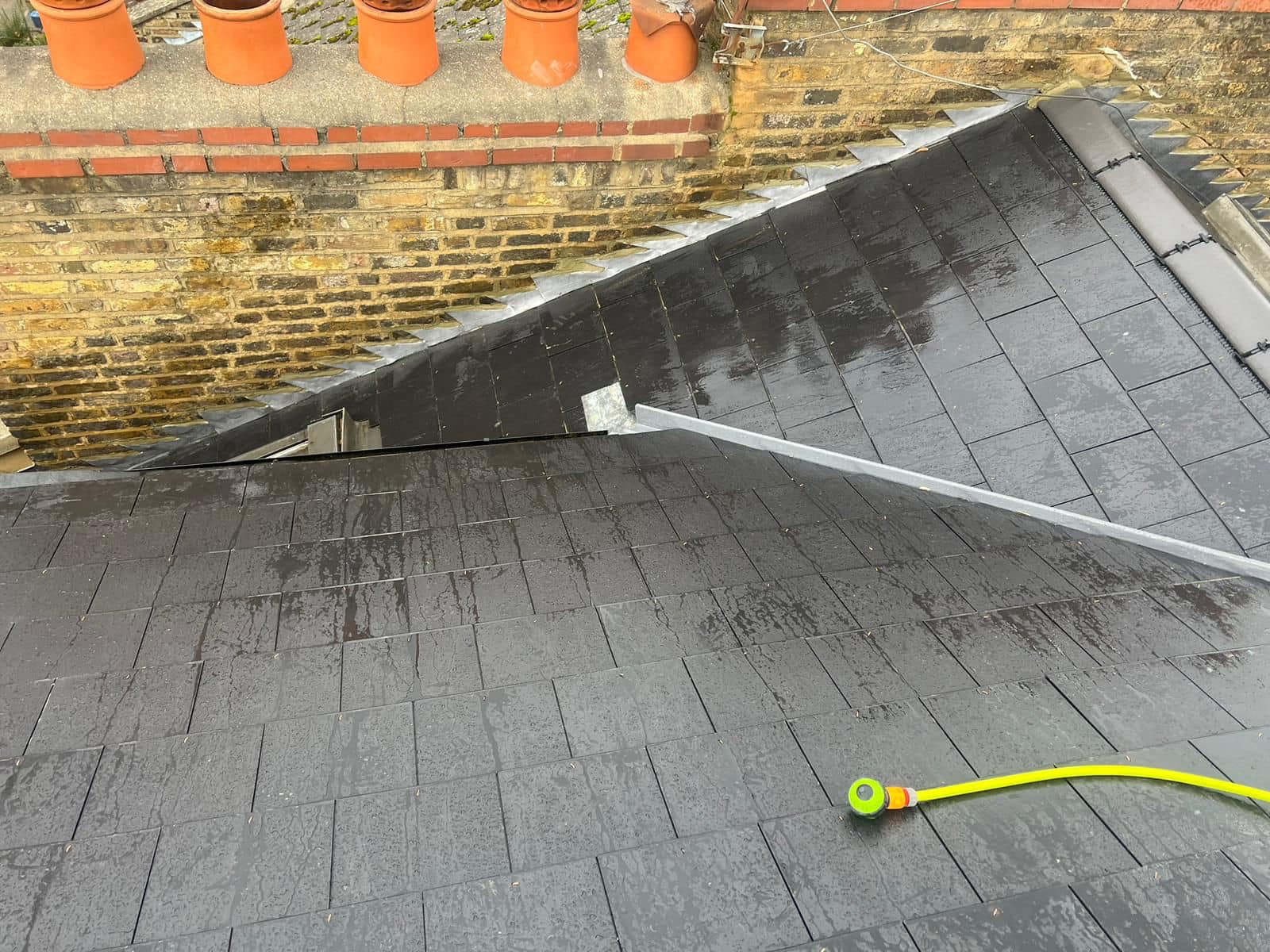 Professional roofers working on a property in London - KS Roof Master