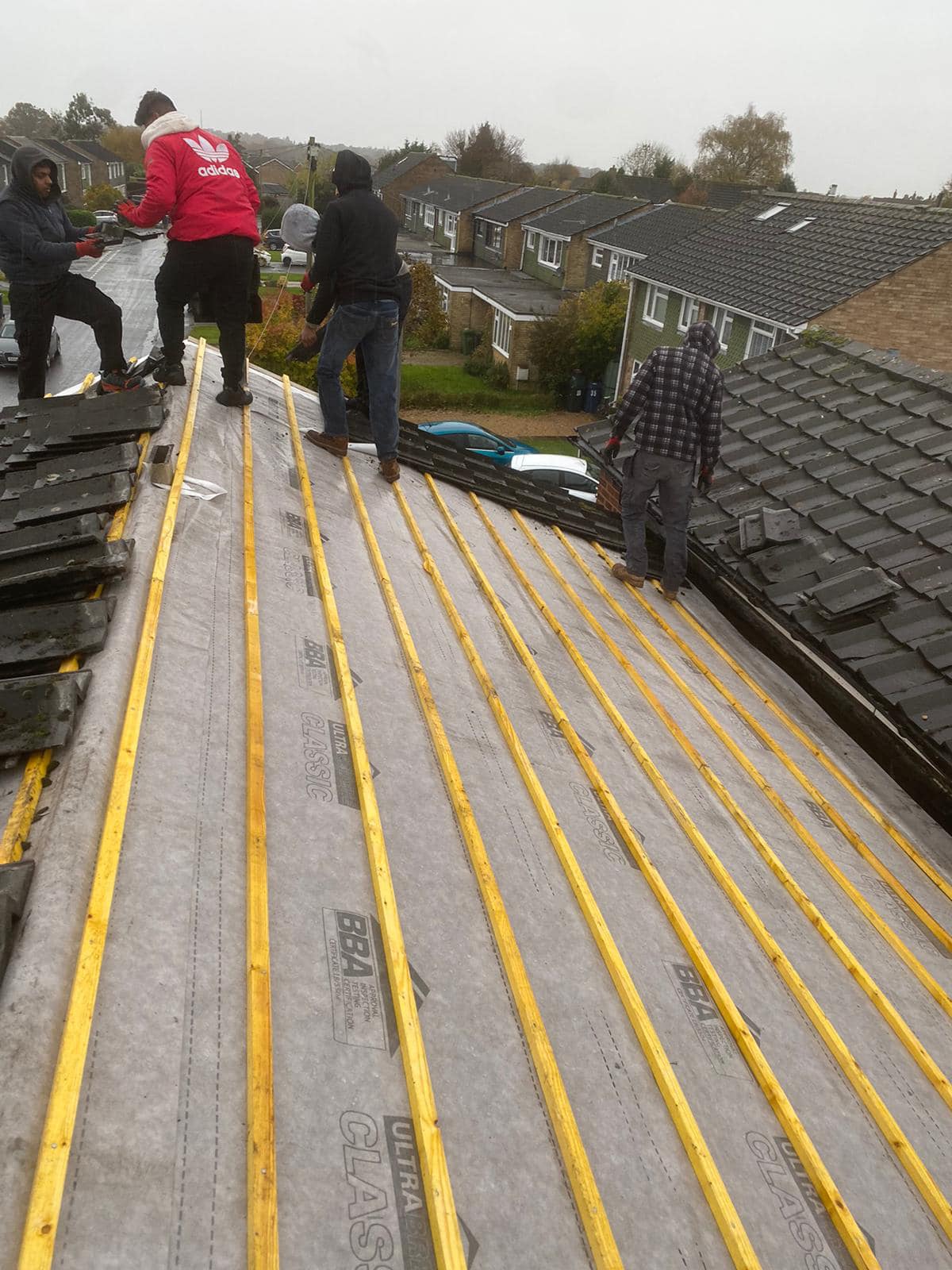Professional roofers working on a property in London - KS Roof Master
