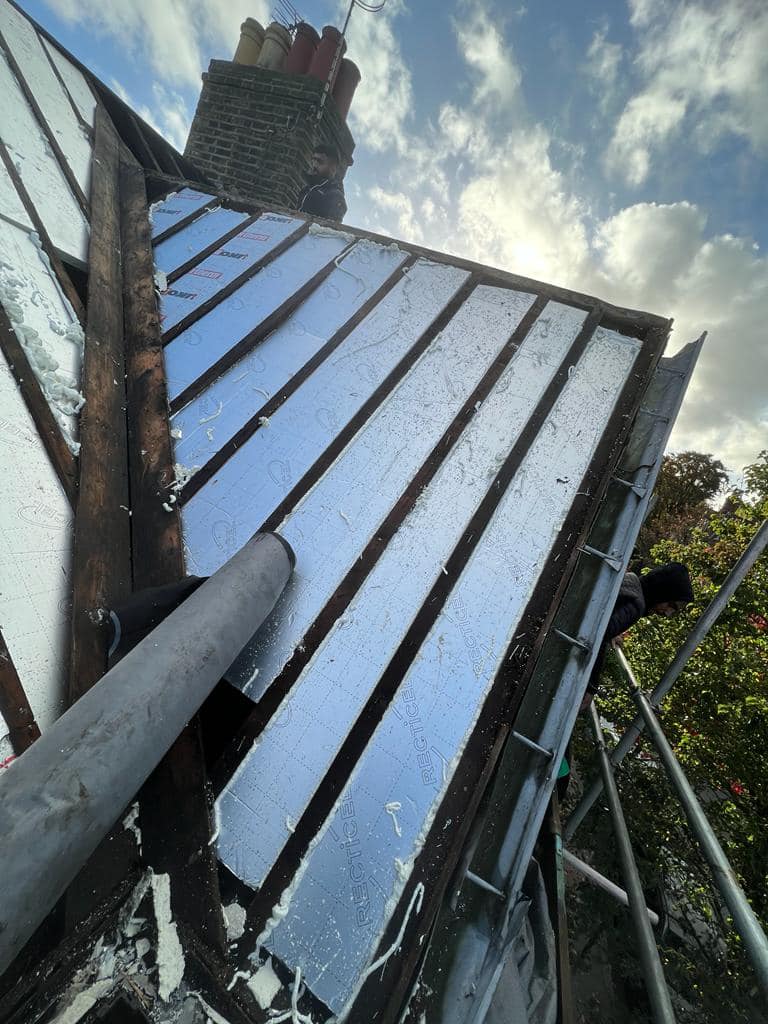 Professional roofers working on a property in London - KS Roof Master