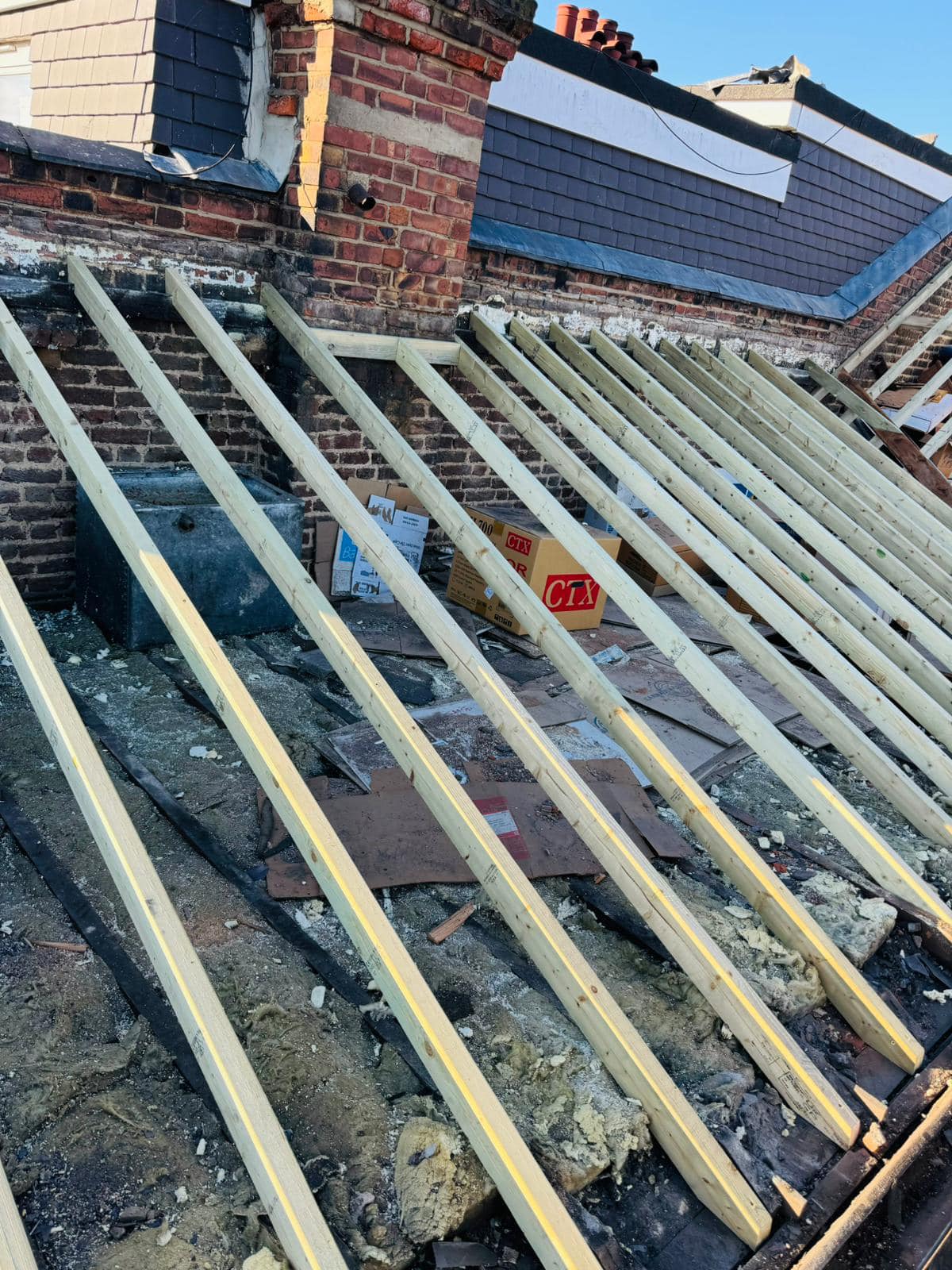 Professional roofers working on a property in London - KS Roof Master