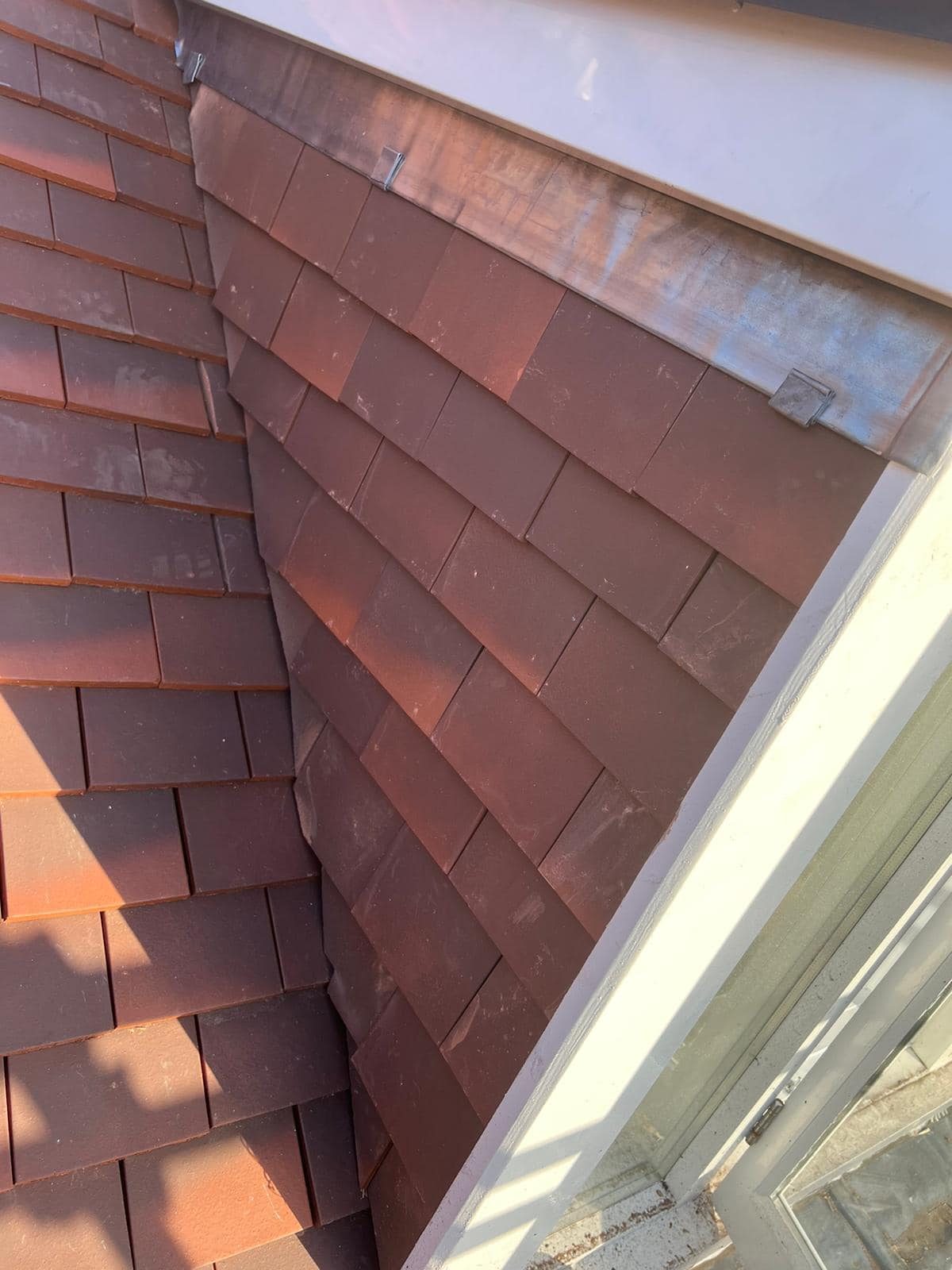 Professional roofers working on a property in London - KS Roof Master