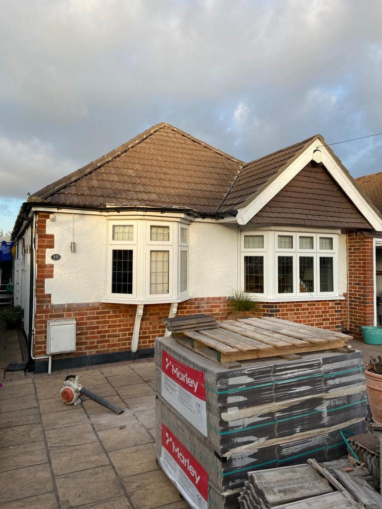Professional roofers working on a property in London - KS Roof Master