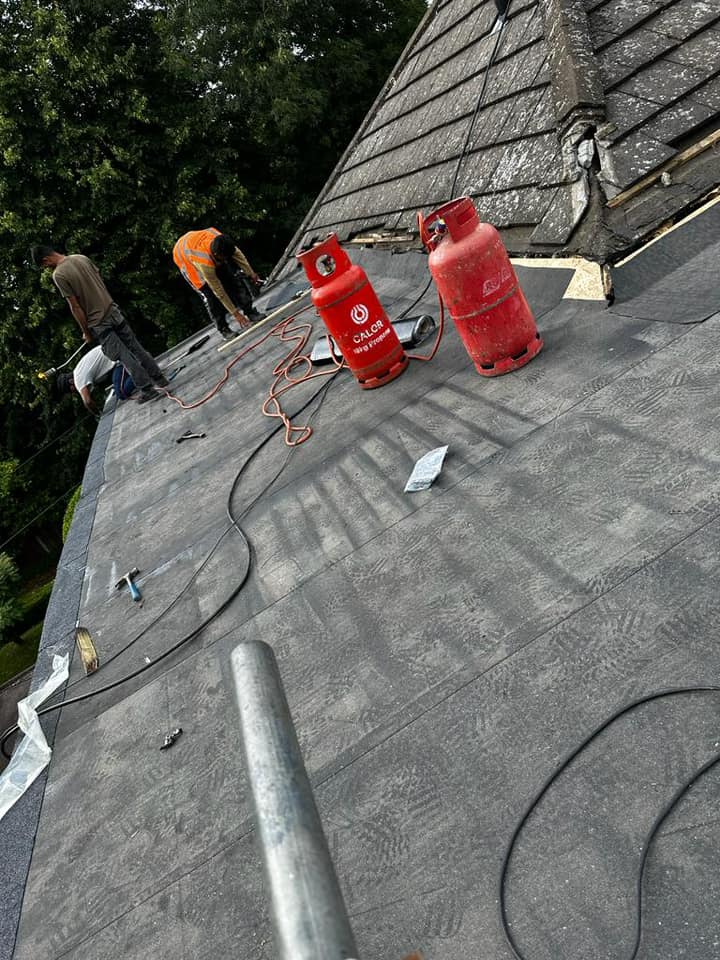 Professional roofers working on a property in London - KS Roof Master