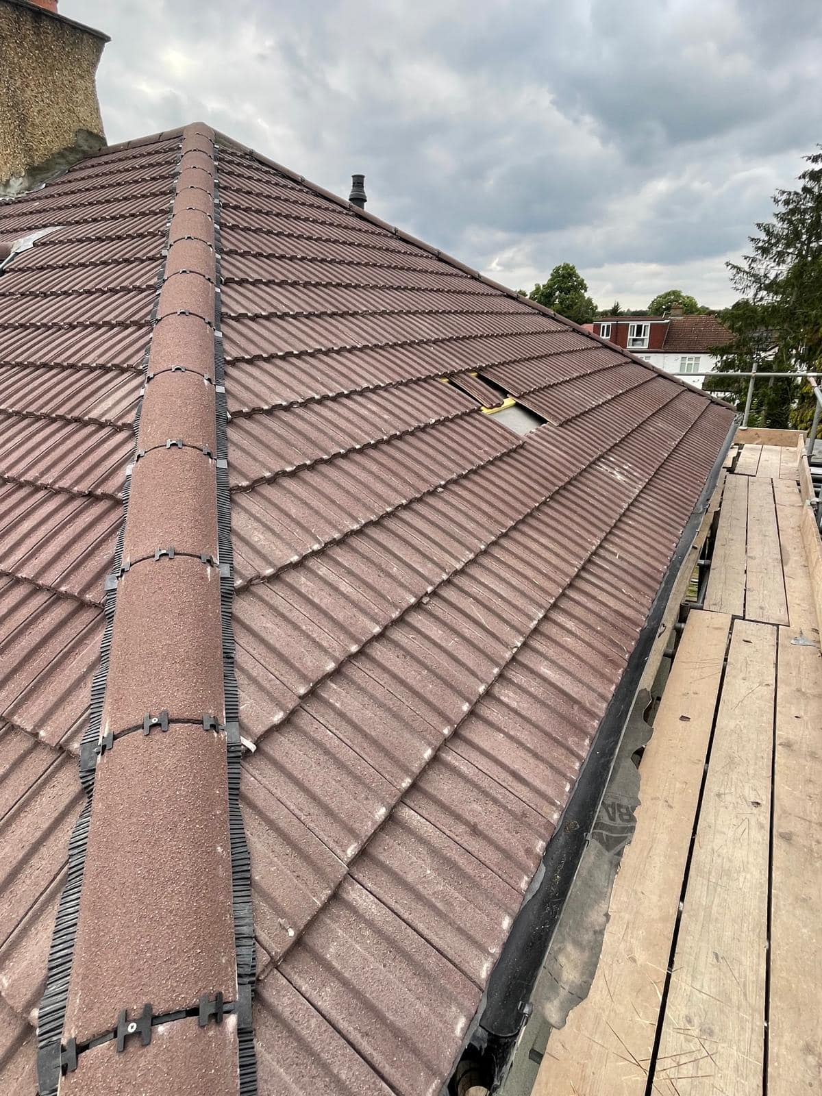 Professional roofers working on a property in London - KS Roof Master