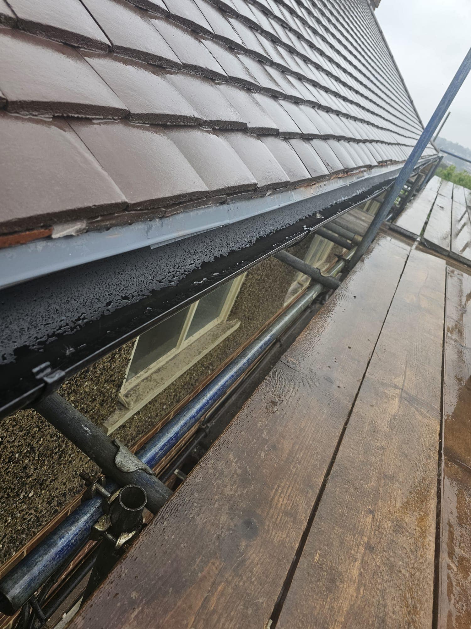 Professional roofers working on a property in London - KS Roof Master