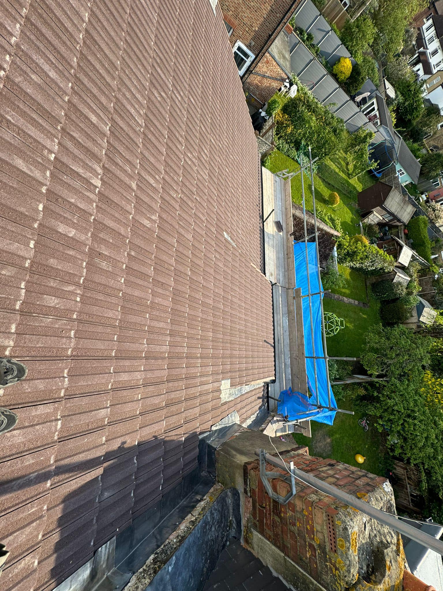 Professional roofers working on a property in London - KS Roof Master
