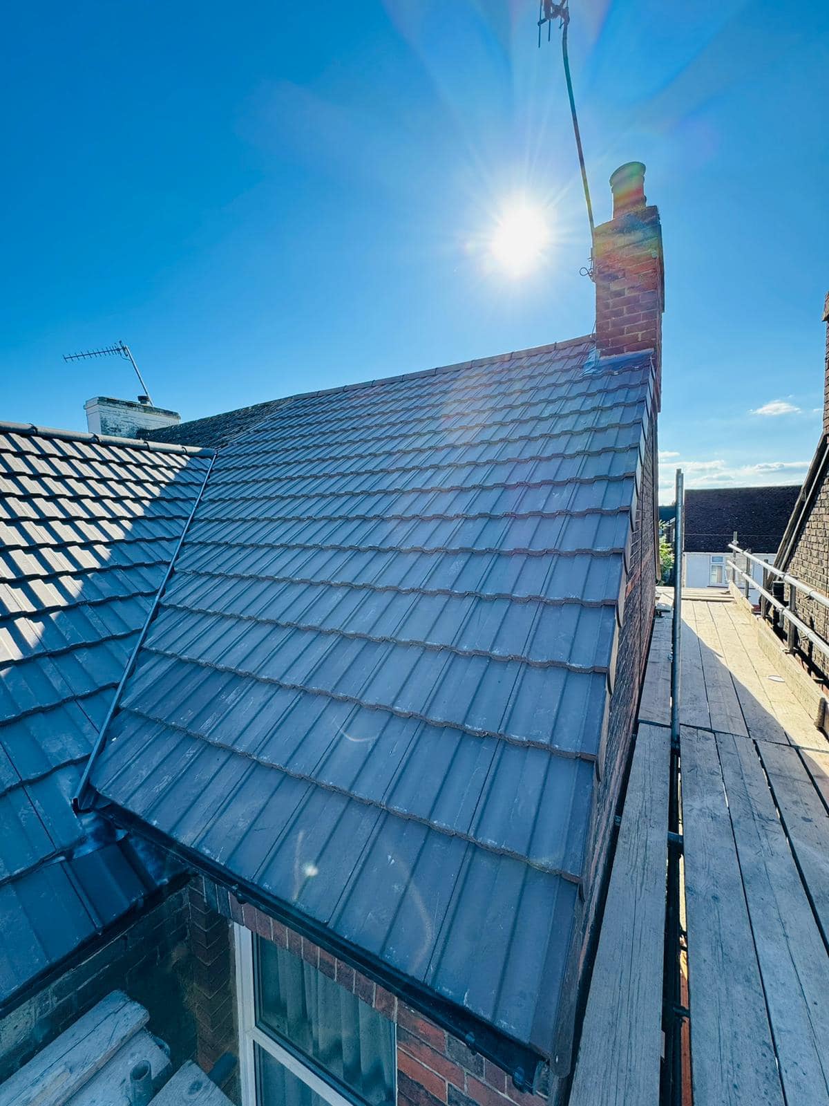 Professional roofers working on a property in London - KS Roof Master