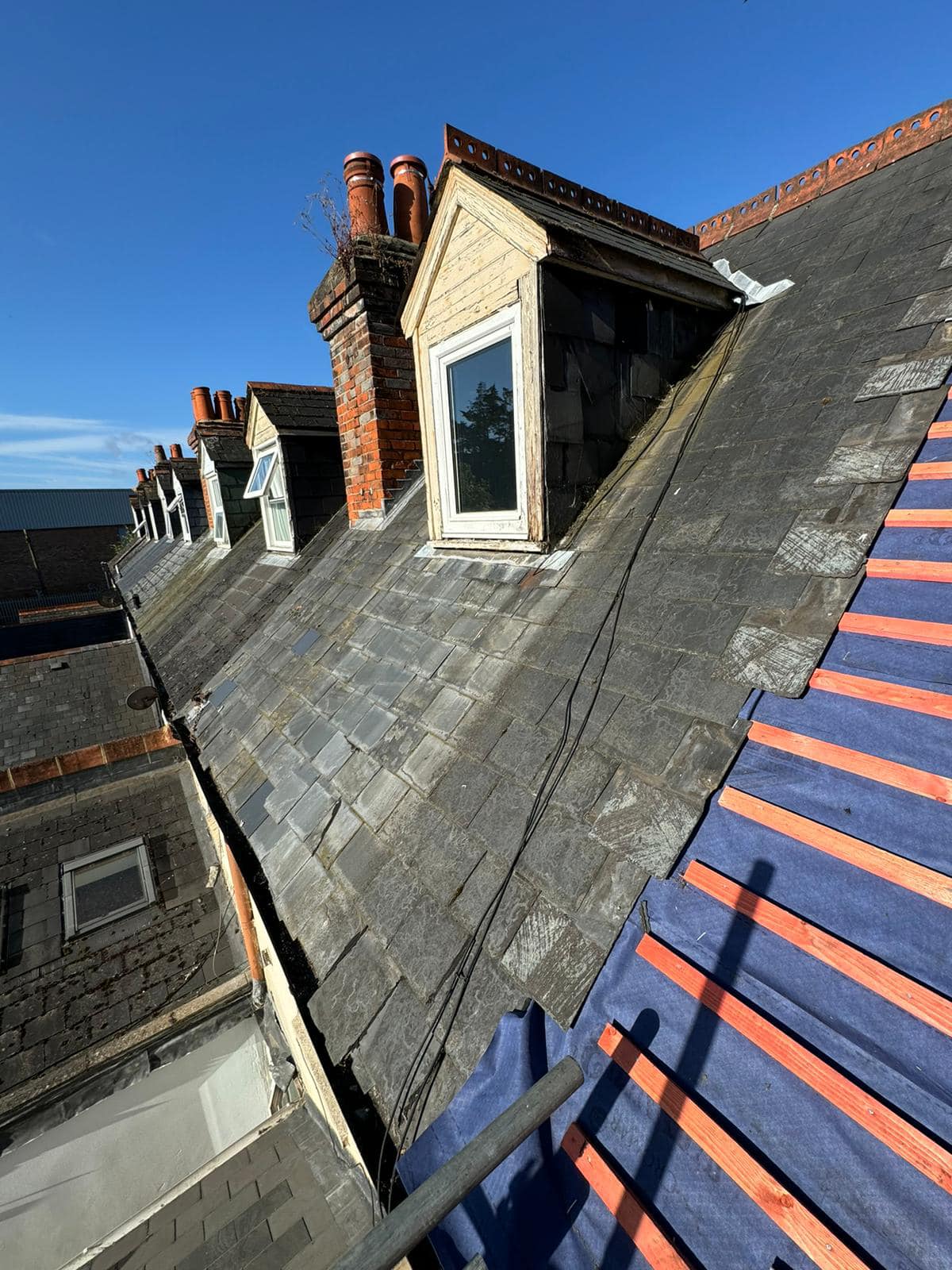 Professional roofers working on a property in London - KS Roof Master