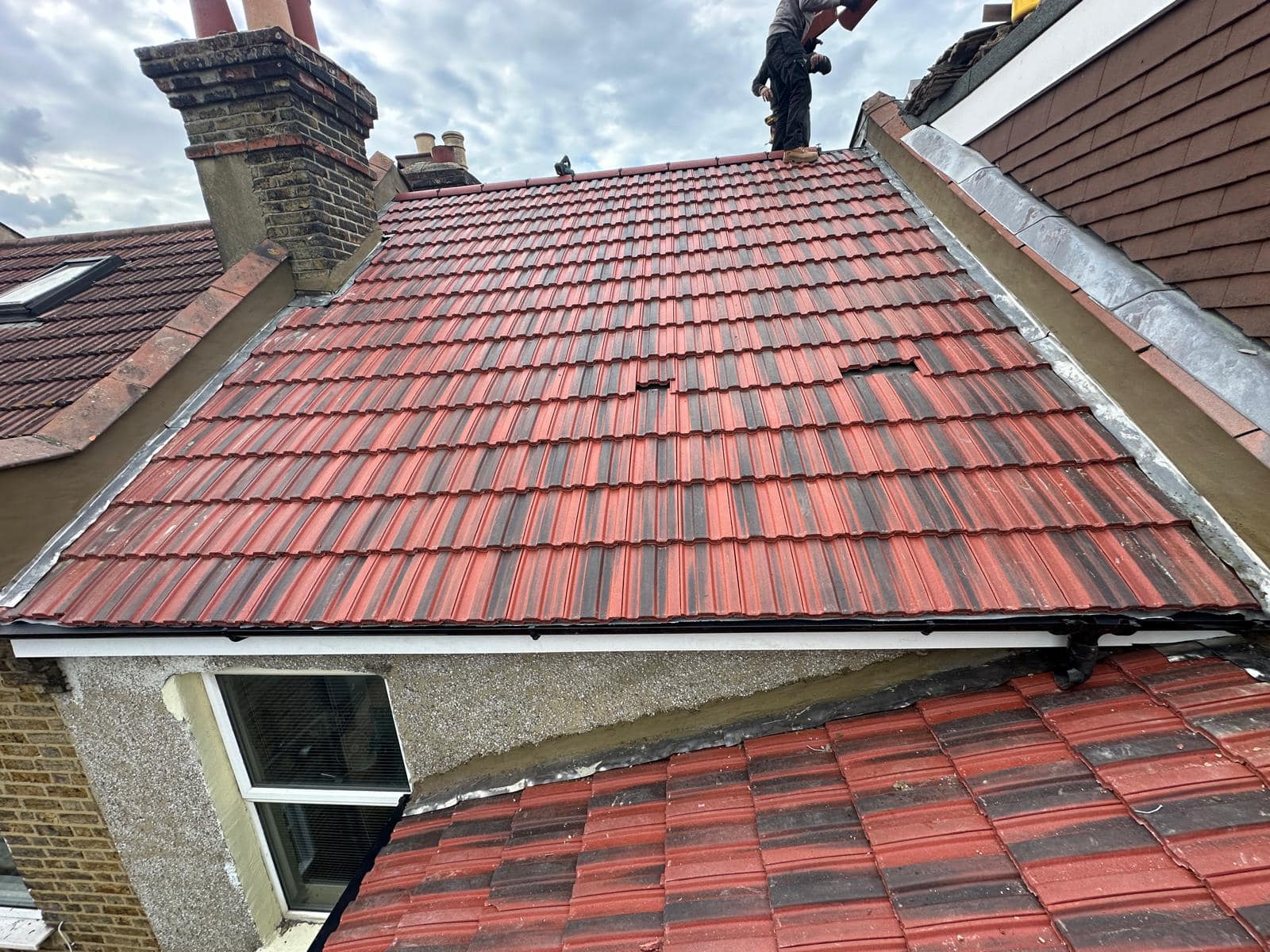 Professional roofers working on a property in London - KS Roof Master