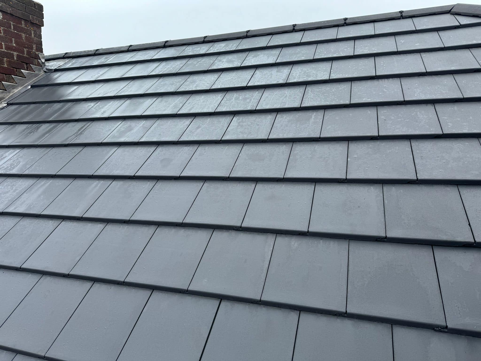 Professional roofers working on a property in London - KS Roof Master