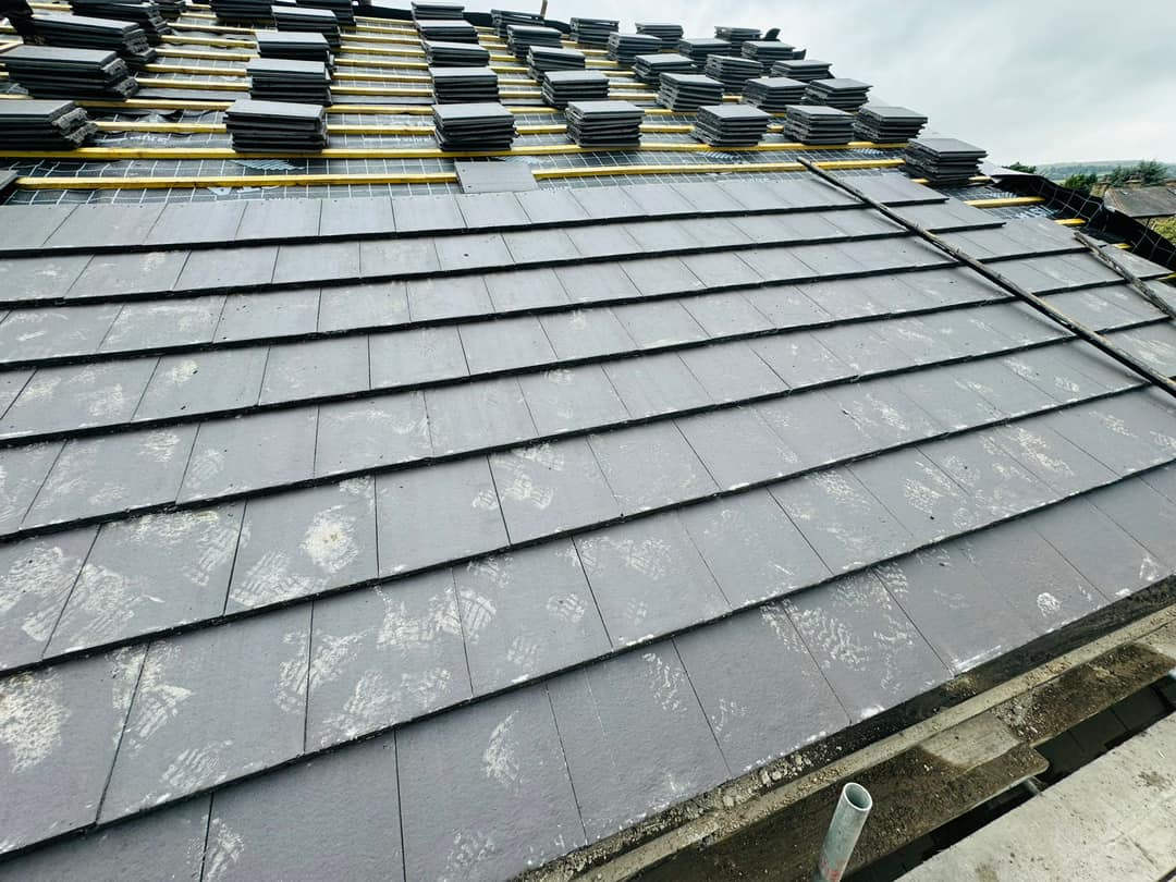 Professional roofers working on a property in London - KS Roof Master
