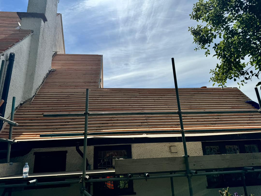 Professional roofers working on a property in London - KS Roof Master