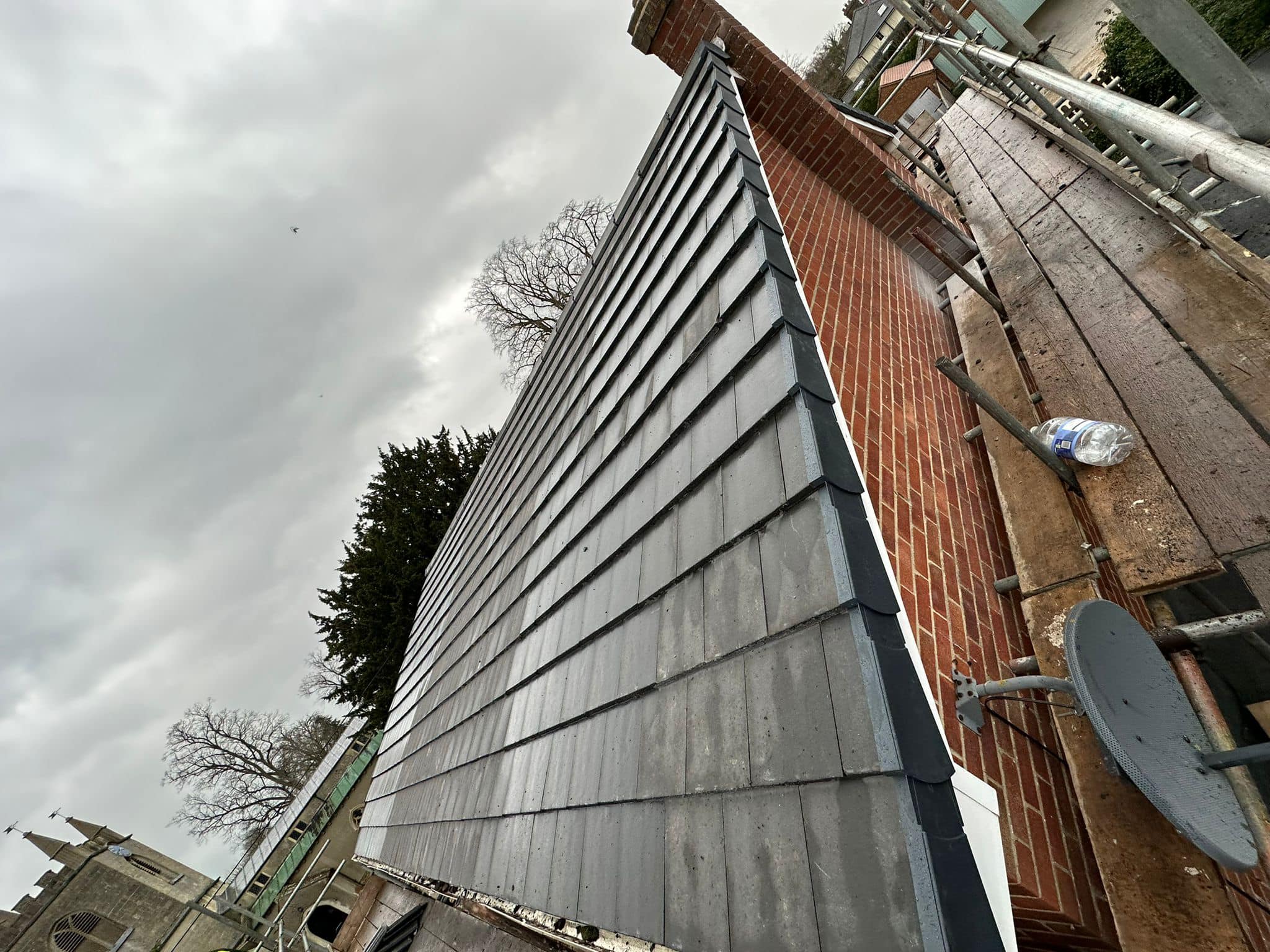 Professional roofers working on a property in London - KS Roof Master