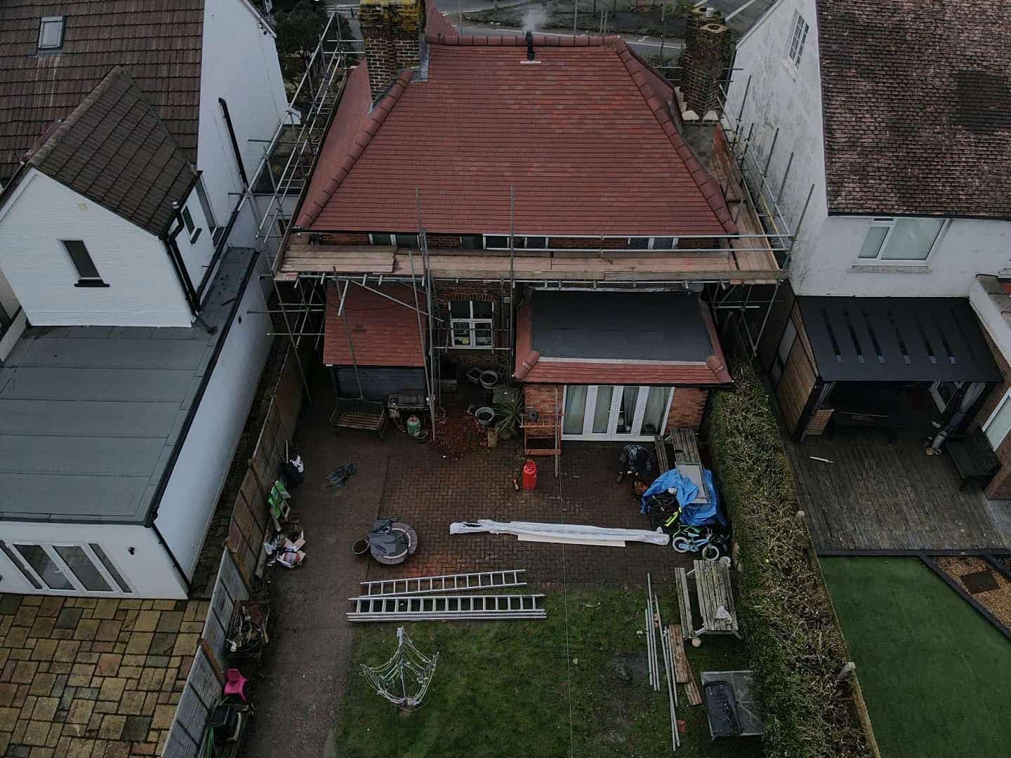 Professional roofers working on a property in London - KS Roof Master