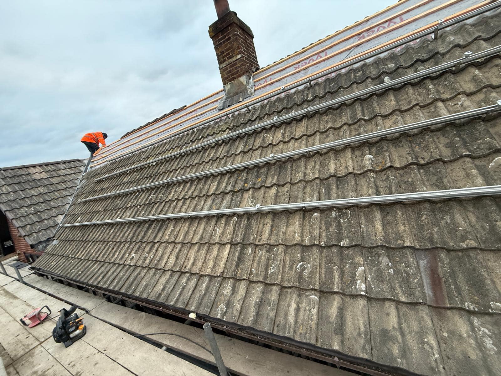 Professional roofers working on a property in London - KS Roof Master