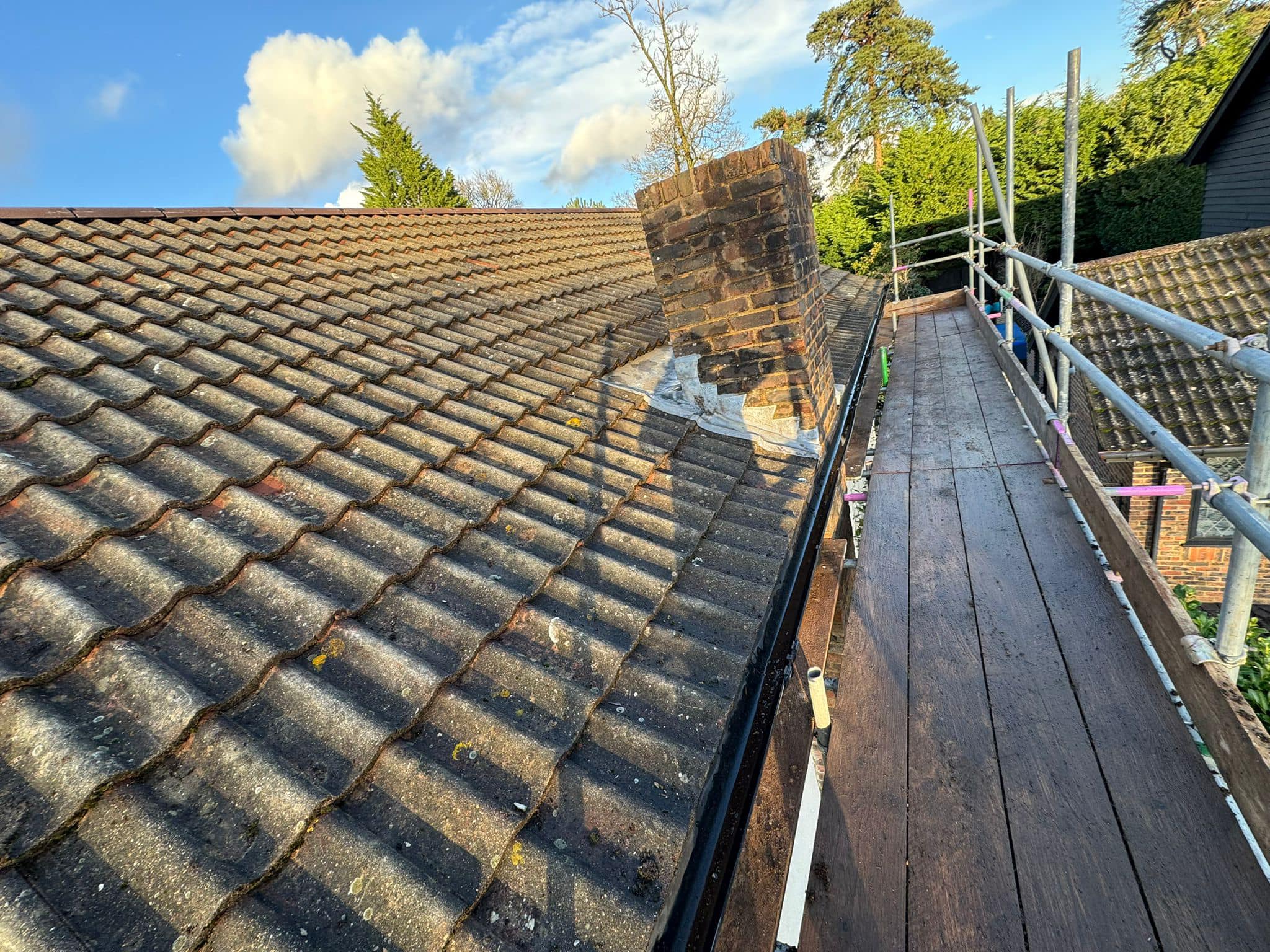 Professional roofers working on a property in London - KS Roof Master