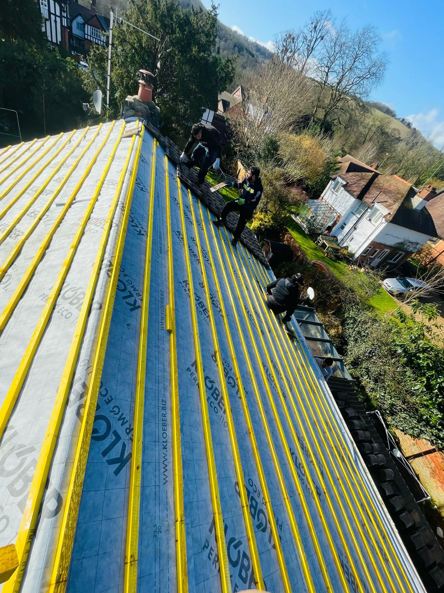 Professional roofers working on a property in London - KS Roof Master