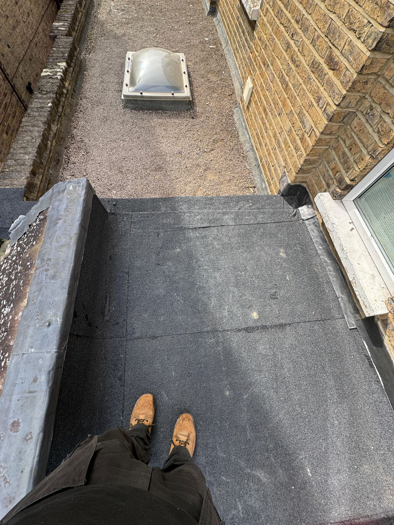 Professional roofers working on a property in London - KS Roof Master