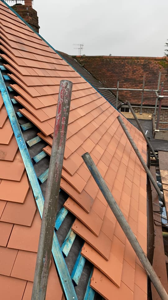 Professional roofers working on a property in London - KS Roof Master