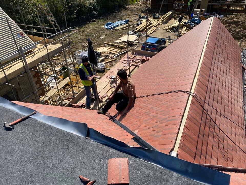 Professional roofers working on a property in London - KS Roof Master