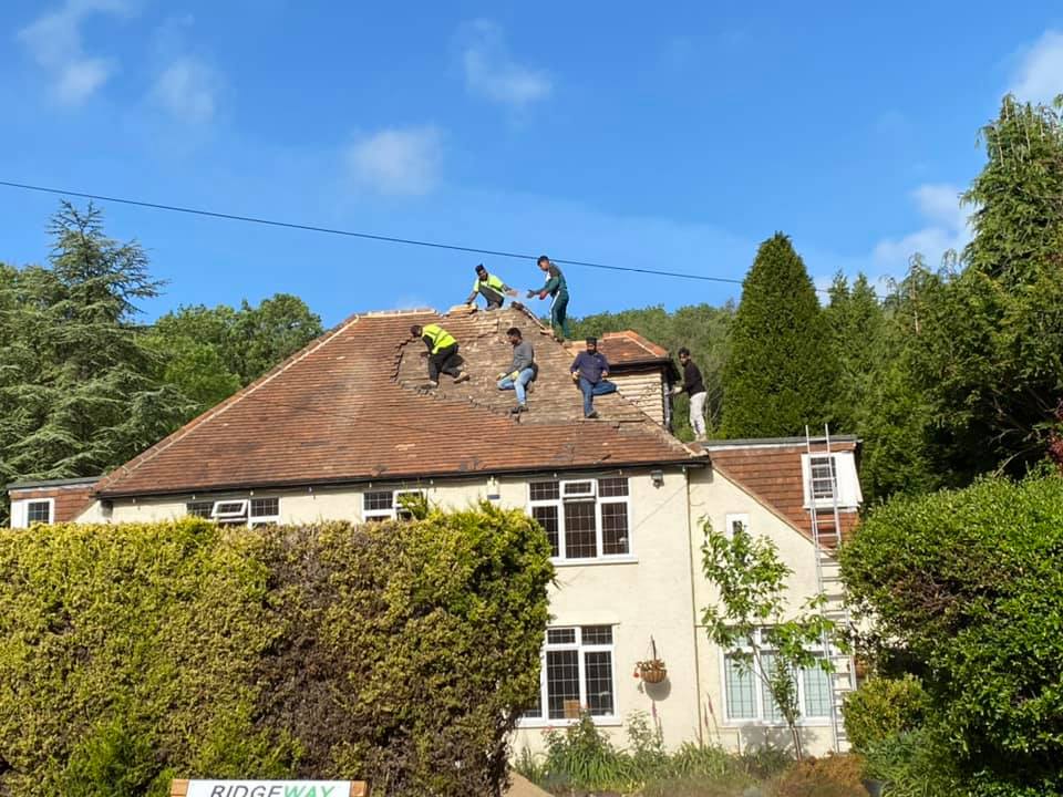 Professional roofers working on a property in London - KS Roof Master