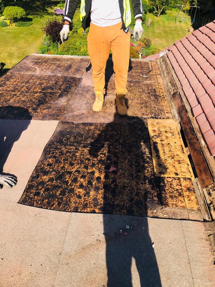 Professional roofers working on a property in London - KS Roof Master