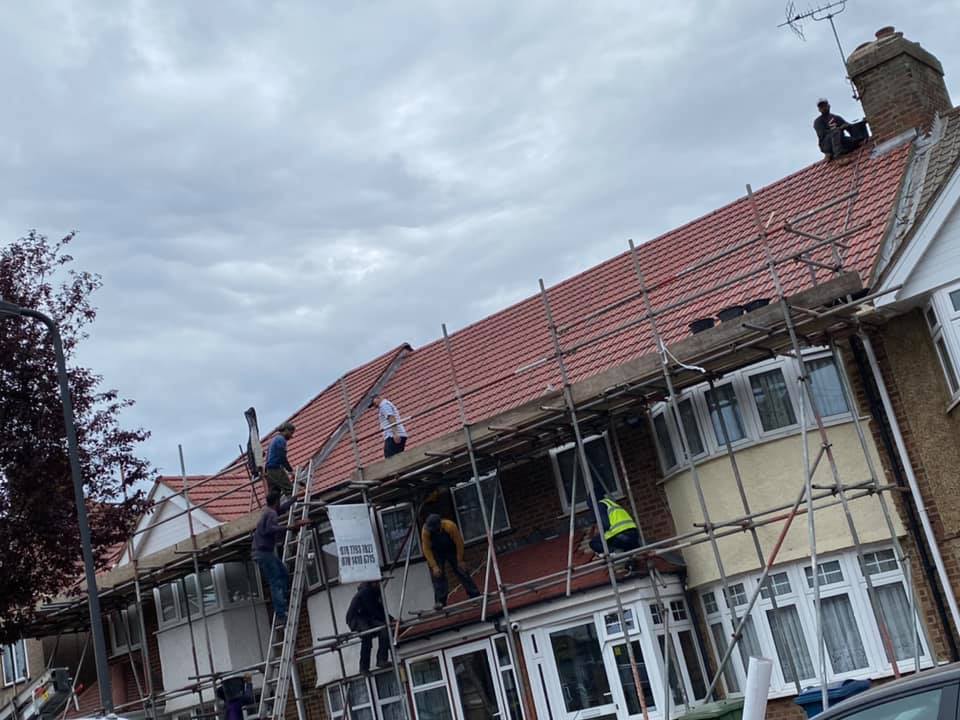 Professional roofers working on a property in London - KS Roof Master