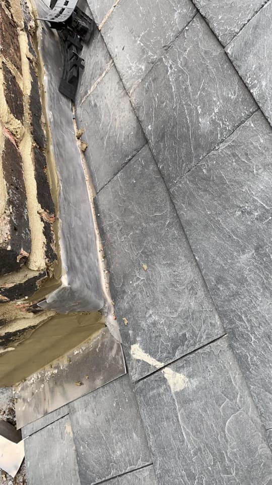 Professional roofers working on a property in London - KS Roof Master