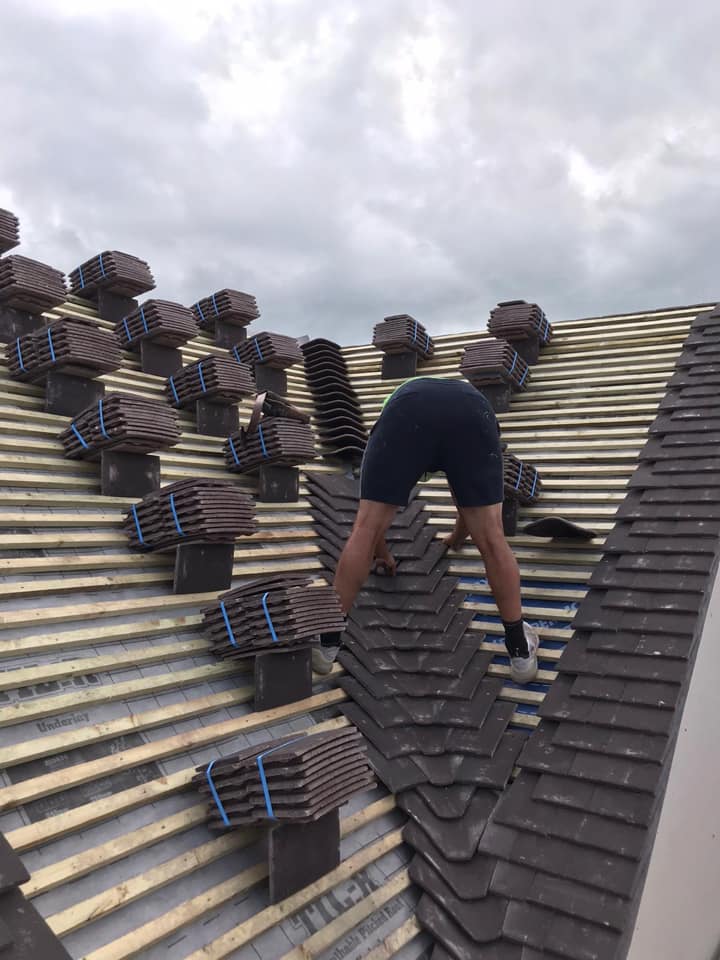 Professional roofers working on a property in London - KS Roof Master