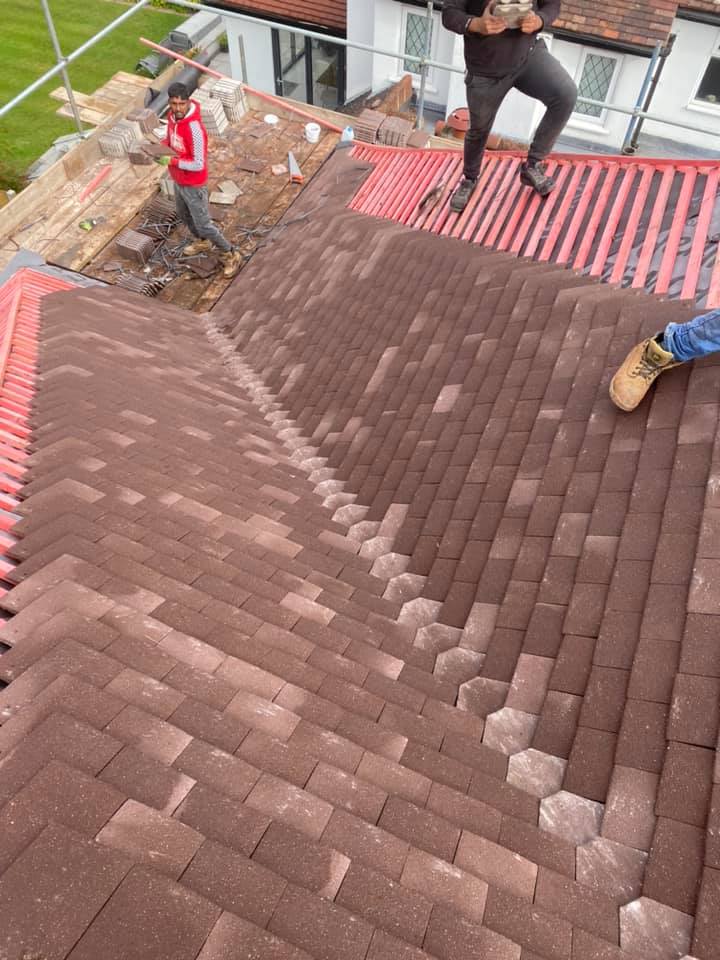 Professional roofers working on a property in London - KS Roof Master