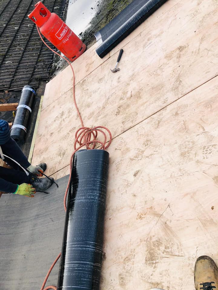 Professional roofers working on a property in London - KS Roof Master