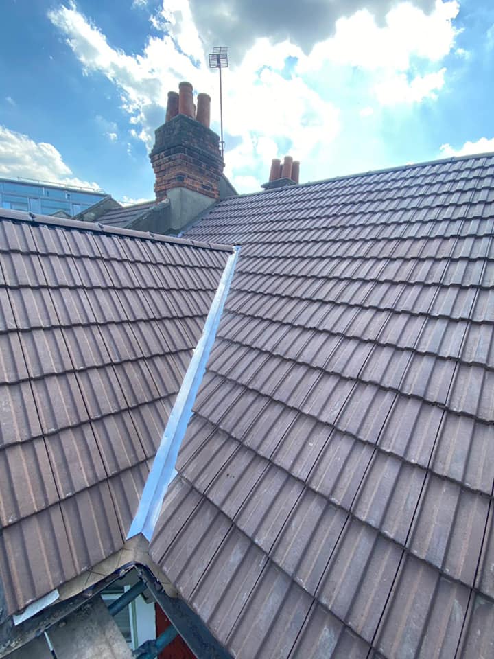 Professional roofers working on a property in London - KS Roof Master