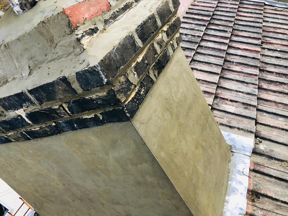 Professional roofers working on a property in London - KS Roof Master