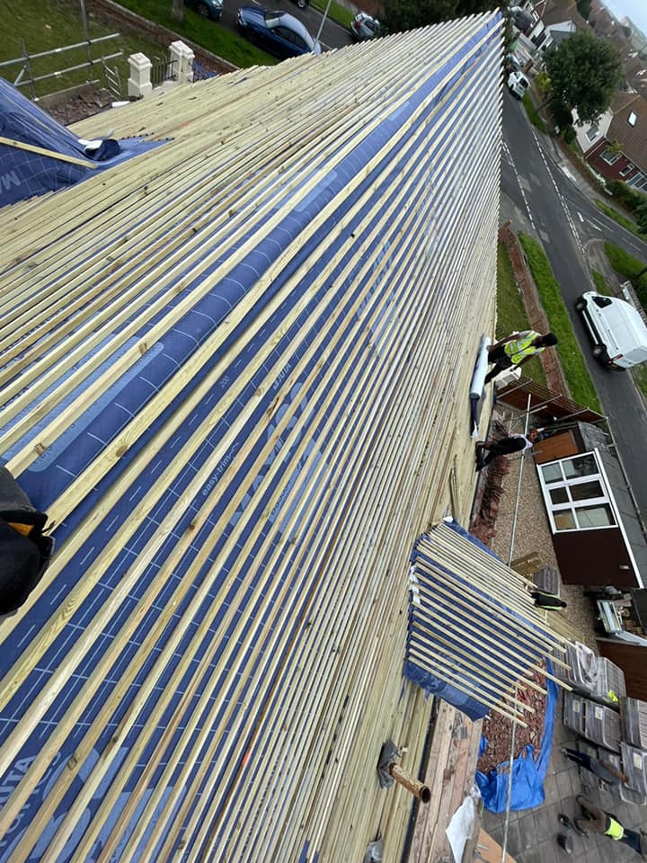 Professional roofers working on a property in London - KS Roof Master