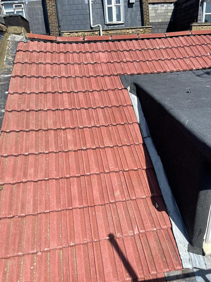 Professional roofers working on a property in London - KS Roof Master