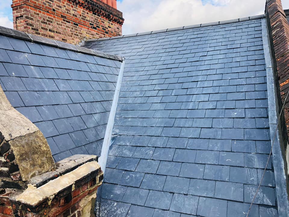 Professional roofers working on a property in London - KS Roof Master