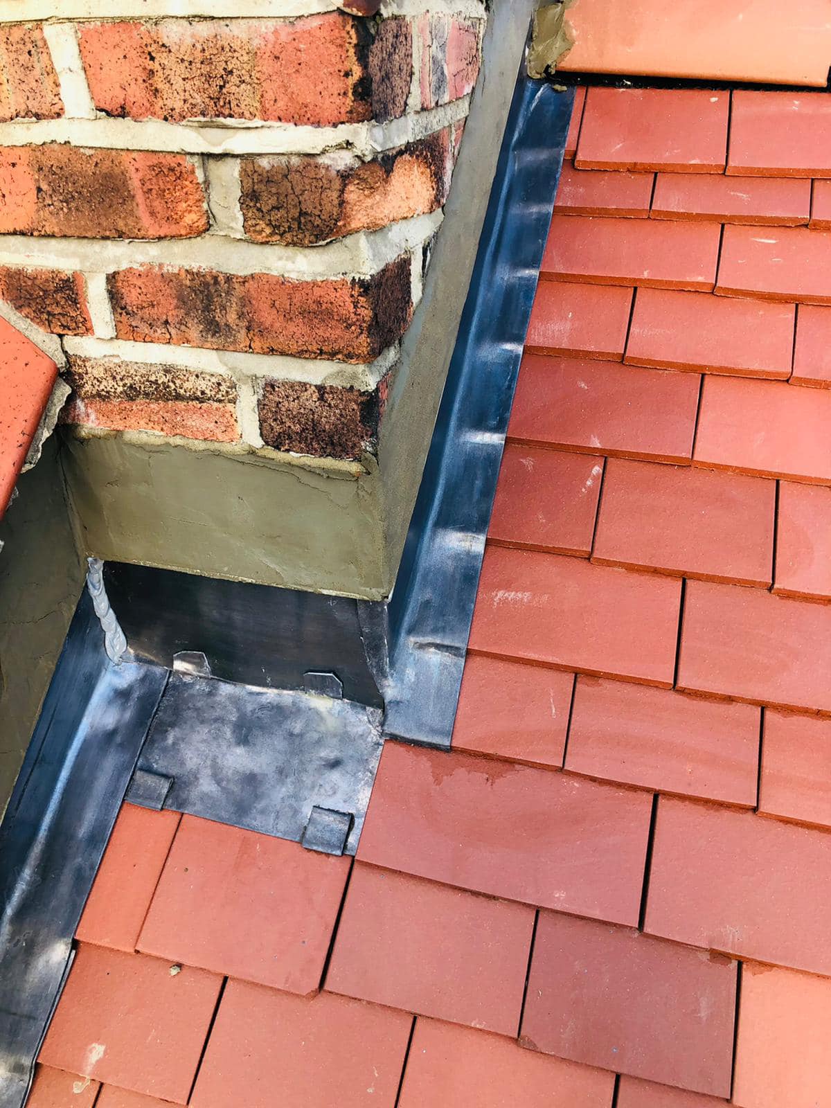 Professional roofers working on a property in London - KS Roof Master