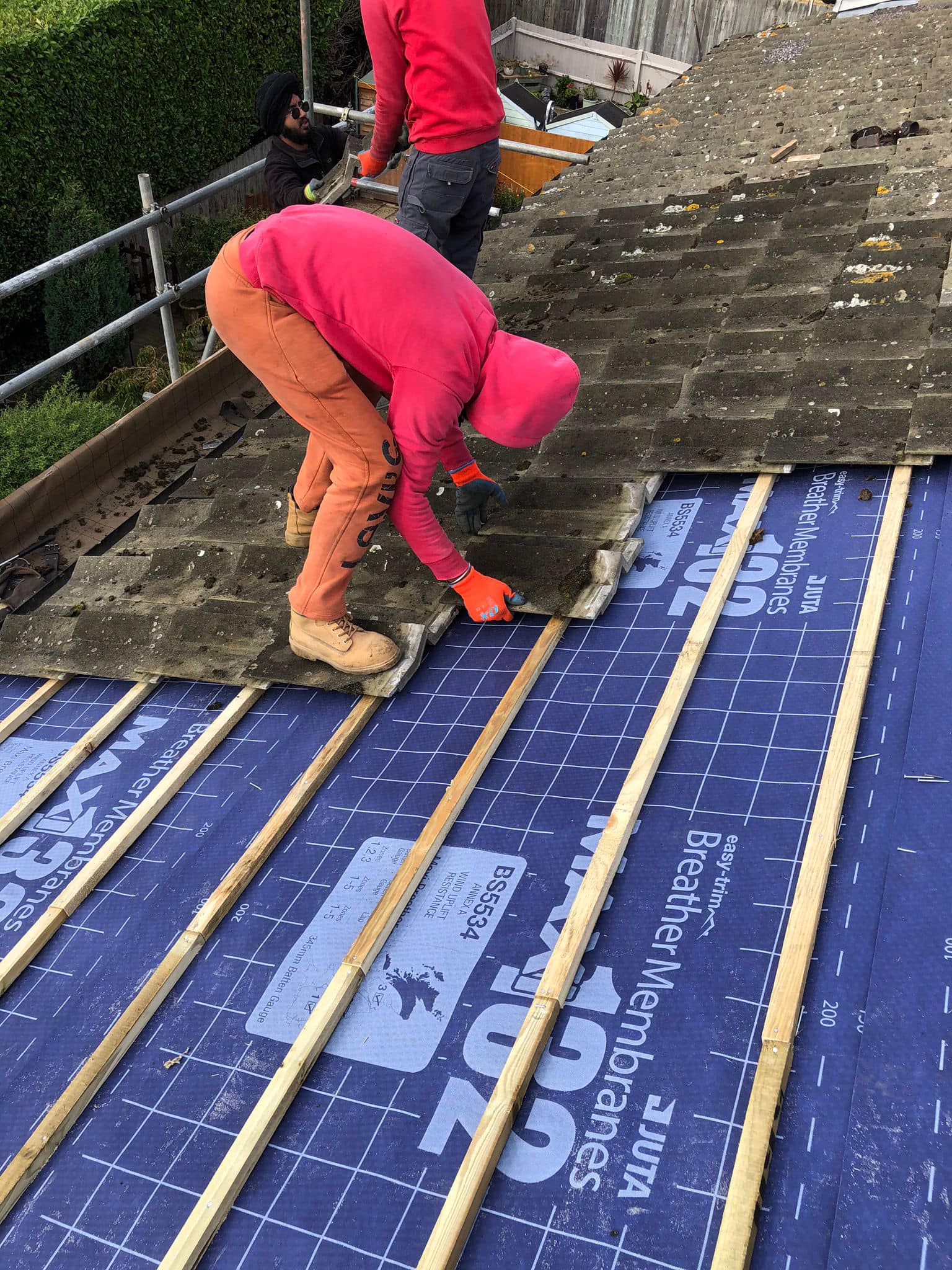Professional roofers working on a property in London - KS Roof Master
