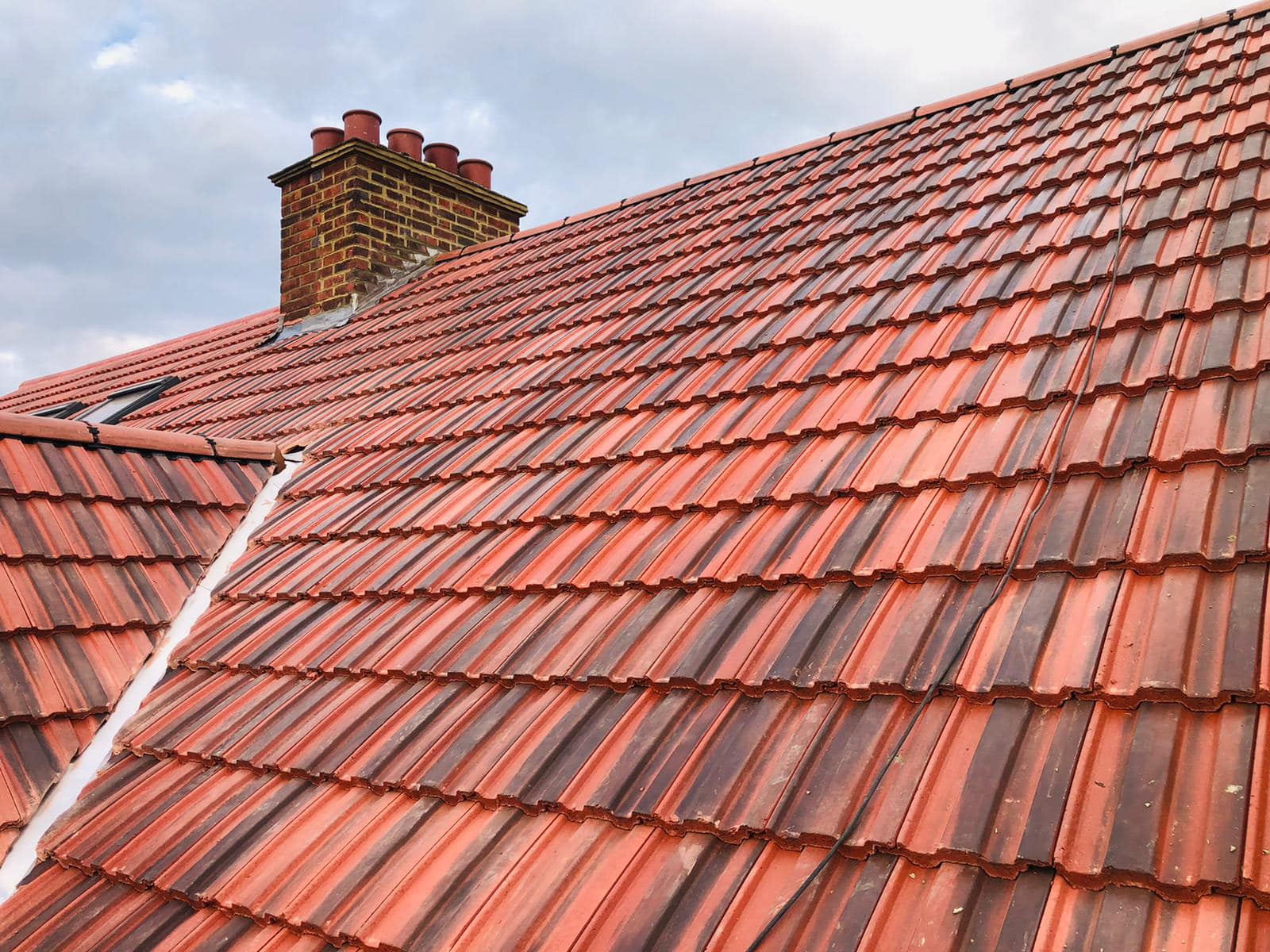 Professional roofers working on a property in London - KS Roof Master