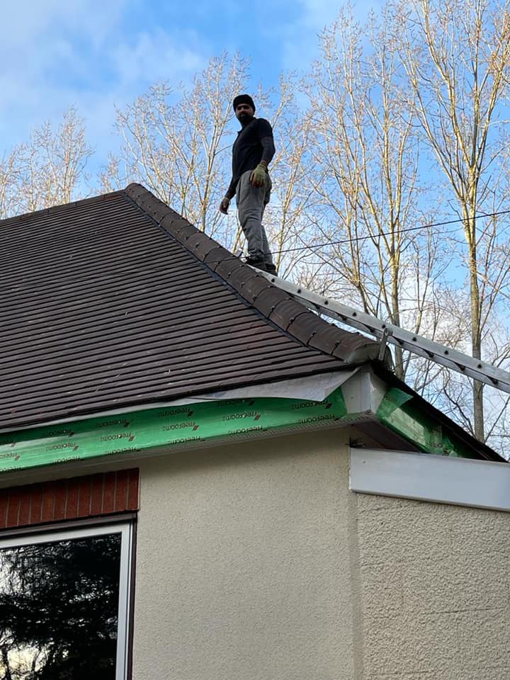 Professional roofers working on a property in London - KS Roof Master