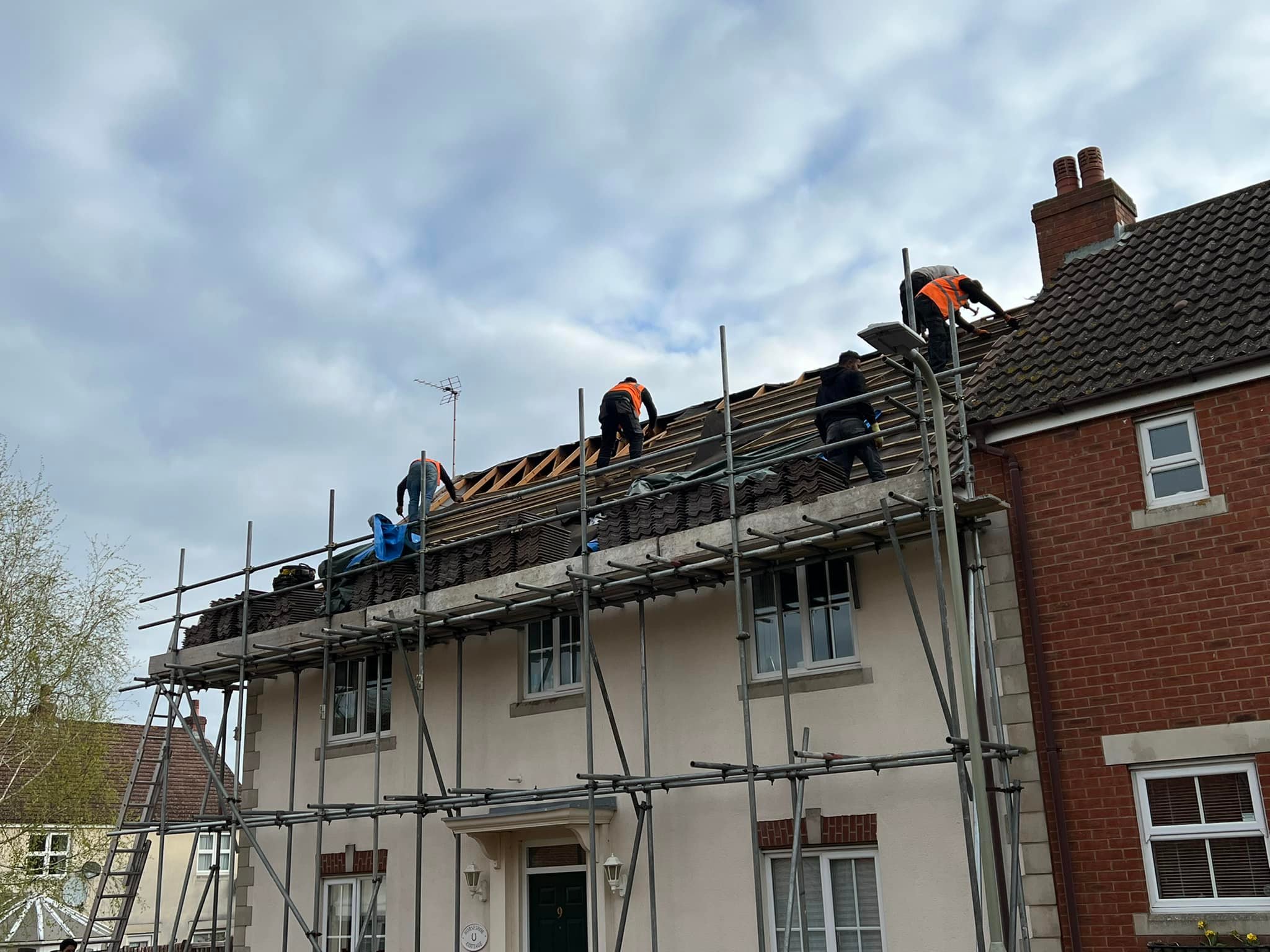 Professional roofers working on a property in London - KS Roof Master
