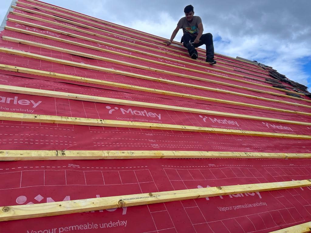 Professional roofers working on a property in London - KS Roof Master