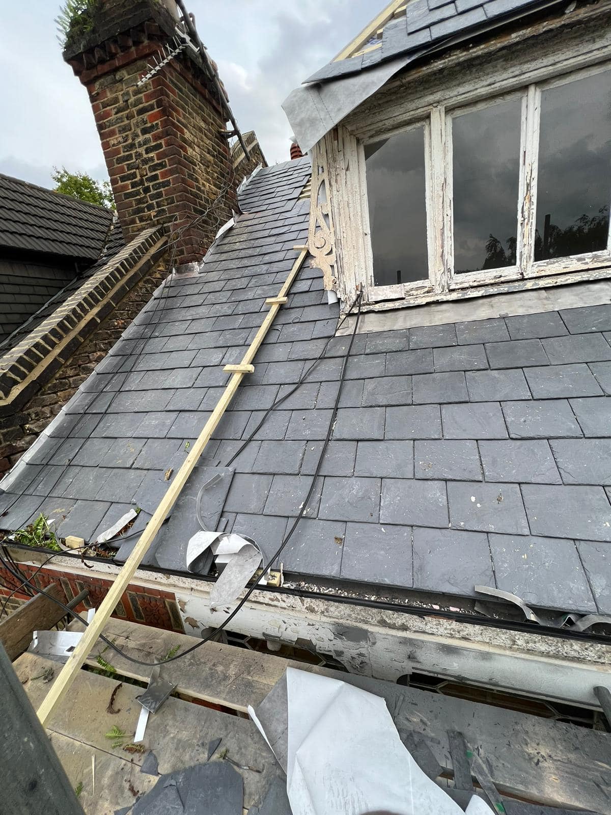 Professional roofers working on a property in London - KS Roof Master