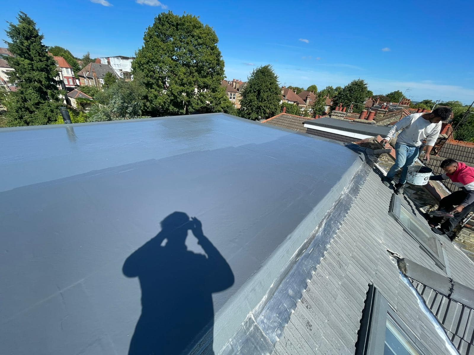 Professional roofers working on a property in London - KS Roof Master