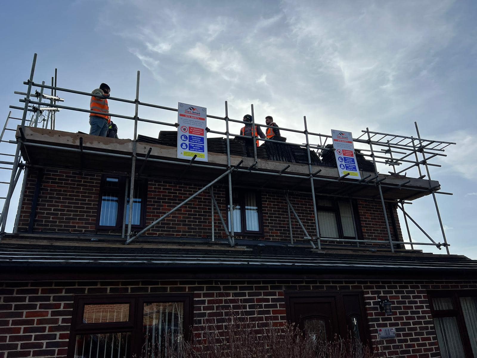 Professional roofers working on a property in London - KS Roof Master