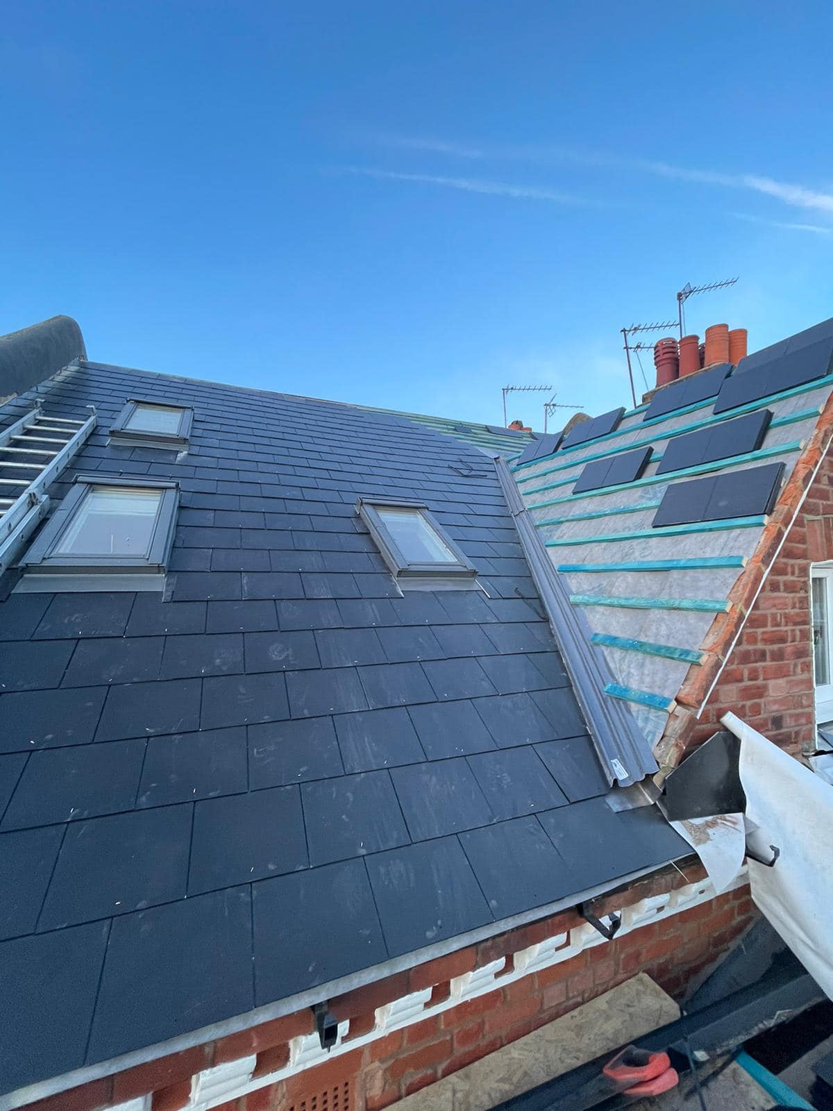 Professional roofers working on a property in London - KS Roof Master
