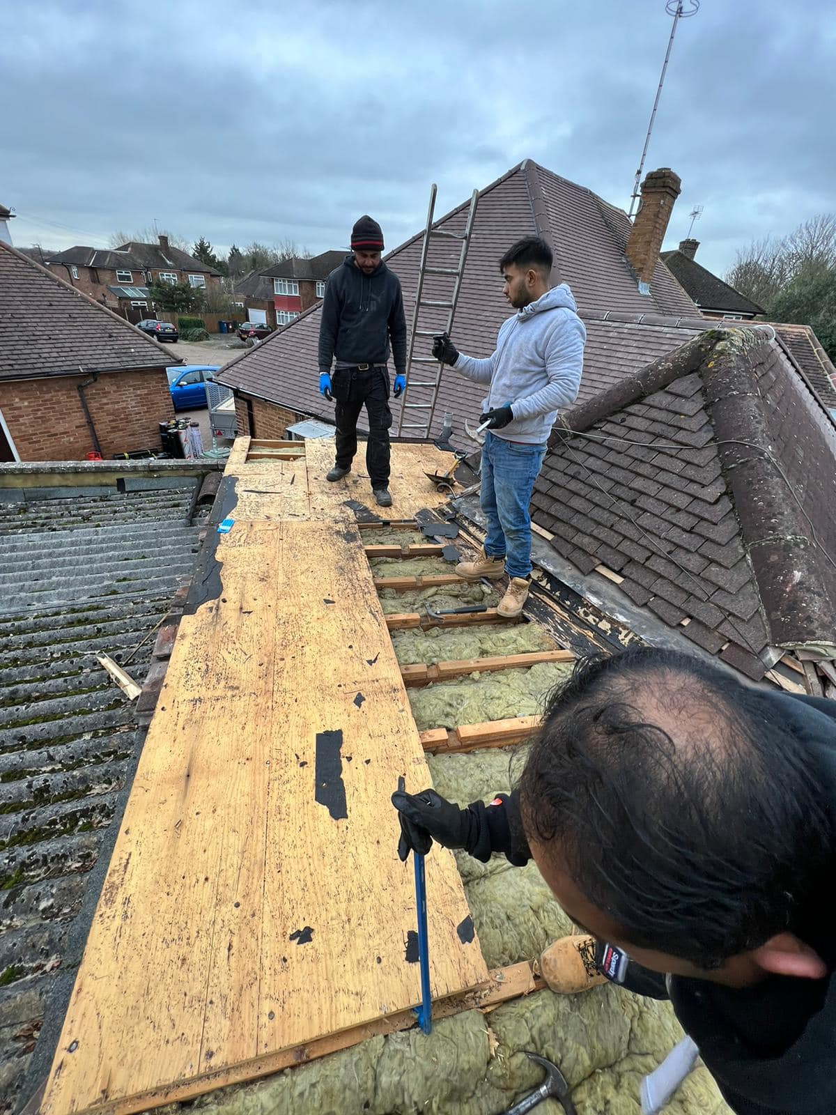 Professional roofers working on a property in London - KS Roof Master