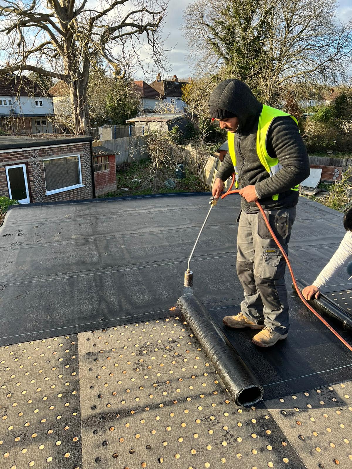 Professional roofers working on a property in London - KS Roof Master